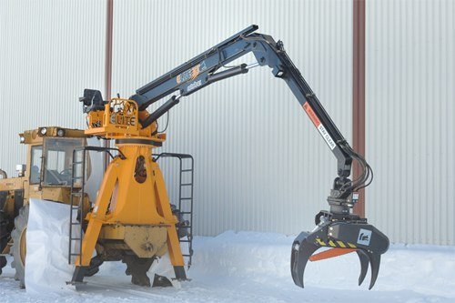Rotobec Elite loader with a log grapple on a stationary pedestal